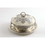 A VICTORIAN CIRCULAR BUTTER DISH AND COVER with matching stand, the whole decorated with linked,a