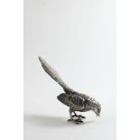 AN EARLY 20TH CENTURY CAST NOVELTY CASTER in the form of a magpie, pecking at the ground, with