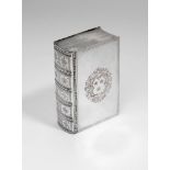 A GEORGE II SILVER TABLE SNUFF BOX in the form of a book with an engraved spine and borders to