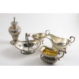A MIXED LOT:- A late Victorian part-fluted milk jug, two sauce boats, a late Victorian embossed