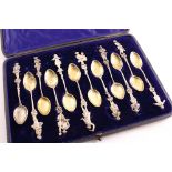 A CASED SET OF LATE 19TH CENTURY CONTINENTAL PARCELGILT TEA SPOONS each with a different classical