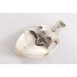 A LATE VICTORIAN ART NOUVEAU CADDY SPOON with a heart-shaped bowl and sinuous handle, rivetted to