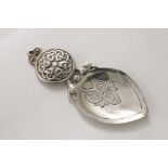 A SCOTTISH CAST CADDY SPOON with a circular lug handle, decorated with "Celtic" knots, and a spade-