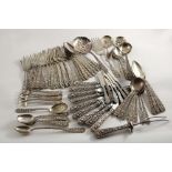 A 20TH CENTURY AMERICAN PART-CANTEEN OF FLATWARE & CUTLERY decorated in relief with a repousse