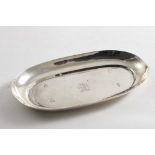 A GEORGE I SPOON TRAY of elongated oval outline with a plain border, engraved in the centre with a