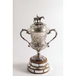 THE CHARD AGRICULTURAL SHOW CUP:- A Victorian trophy cup & cover with embossed decoration with a