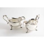 A PAIR OF EARLY VICTORIAN SAUCE BOATS with shaped gadrooned rims, scroll handles and fluted scroll