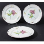 SET OF THREE FRENCH FAIENCE PLATES, late 18th or early 19th century, painted with famille rose style