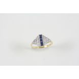 A SAPPHIRE AND DIAMOND RING centred with four calibre-cut sapphires with six circular-cut diamonds
