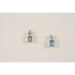 A PAIR OF AQUAMARINE AND DIAMOND DROP EARRINGS each set with a step-cut aquamarine suspended from