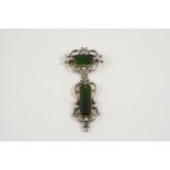 A VICTORIAN TOURMALINE AND DIAMOND BROOCH the two rectangular-shaped green tourmalines are set