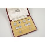 A CASED SET OF DRESS CUFFLINKS, BUTTONS AND STUDS each circular mother-of-pearl disc is centred with