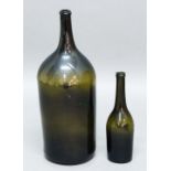 LARGE OLIVE GREEN WINE BOTTLE, probably mid-late 18th century, with broad stringing to the neck