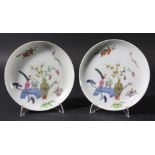 PAIR OF CHINESE FAMILLE ROSE SAUCER DISHES, 19th century, enamelled with vases of flowers and ruyi
