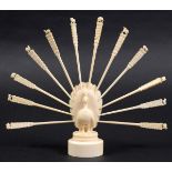 INDIAN IVORY TOOTH PICK HOLDER, 19th century, carved as a peacock with its tail fanned, with