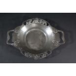 LIBERTY TUDRIC DISH a pewter two handled dish, hand beaten and designed with flowers around the