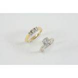 A DIAMOND SOLITAIRE RING the round brilliant-cut diamond is set in 14ct. white gold, size G 1/2,