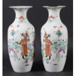 PAIR OF CHINESE FAMILLE ROSE VASES, 19th century, enamelled with boys playing in a fenced garden