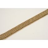 A 14CT. GOLD FANCY LINK BRACELET with concealed clasp, 18.5cm. long, 50 grams.