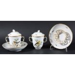 PAIR OF MEISSEN STYLE CHOCOLATE CUPS, COVERS AND TREMBLEUSE SAUCERS, painted with garden birds and