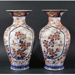 PAIR OF JAPANESE IMARI VASES, 19th century, of baluster form, decorated with ogee panels of