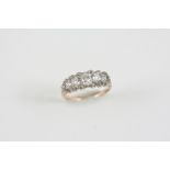 A DIAMOND HALF HOOP RING the seven graduated old cushion-shaped diamonds are set with rose-cut