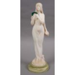 ART NOUVEAU FIGURE - AFTER MAURICE BOUVAL (1863-1916) a carved alabaster figure of a lady, holding a