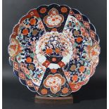 JAPANESE LARGE IMARI CHARGER, 19th century, of scalloped form, painted with a central vase of