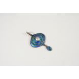 AN ART NOUVEAU ENAMEL AND SILVER PENDANT BY MURRLE, BENNETT & CO. the silver pendant with blue and