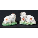 PAIR OF DERBY SHEEP, late 18th century, modelled recumbent on floral bases, length 7cm (2)