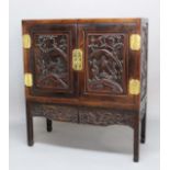 CHINESE EXPORT HARDWOOD AND BRASS MOUNTED CABINET ON STAND, 19th century, the pair of doors