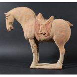 CHINESE TERRACOTTA FIGURE OF A HORSE, possibly Tang Dynasty, standing four square, its mouth open