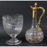 GILT METAL MOUNTED CLARET JUG, of globe and shaft form, the handle formed as scrolling vines, height