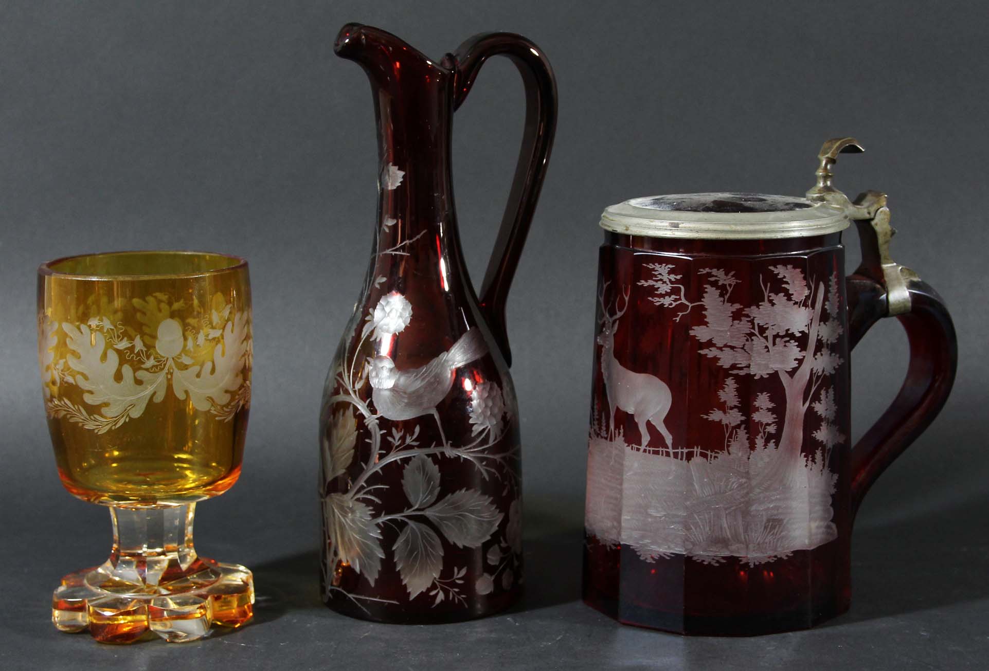 BOHEMIAN GLASS TANKARD AND COVER, 19th century, of tapering form, red cut through to clear with a