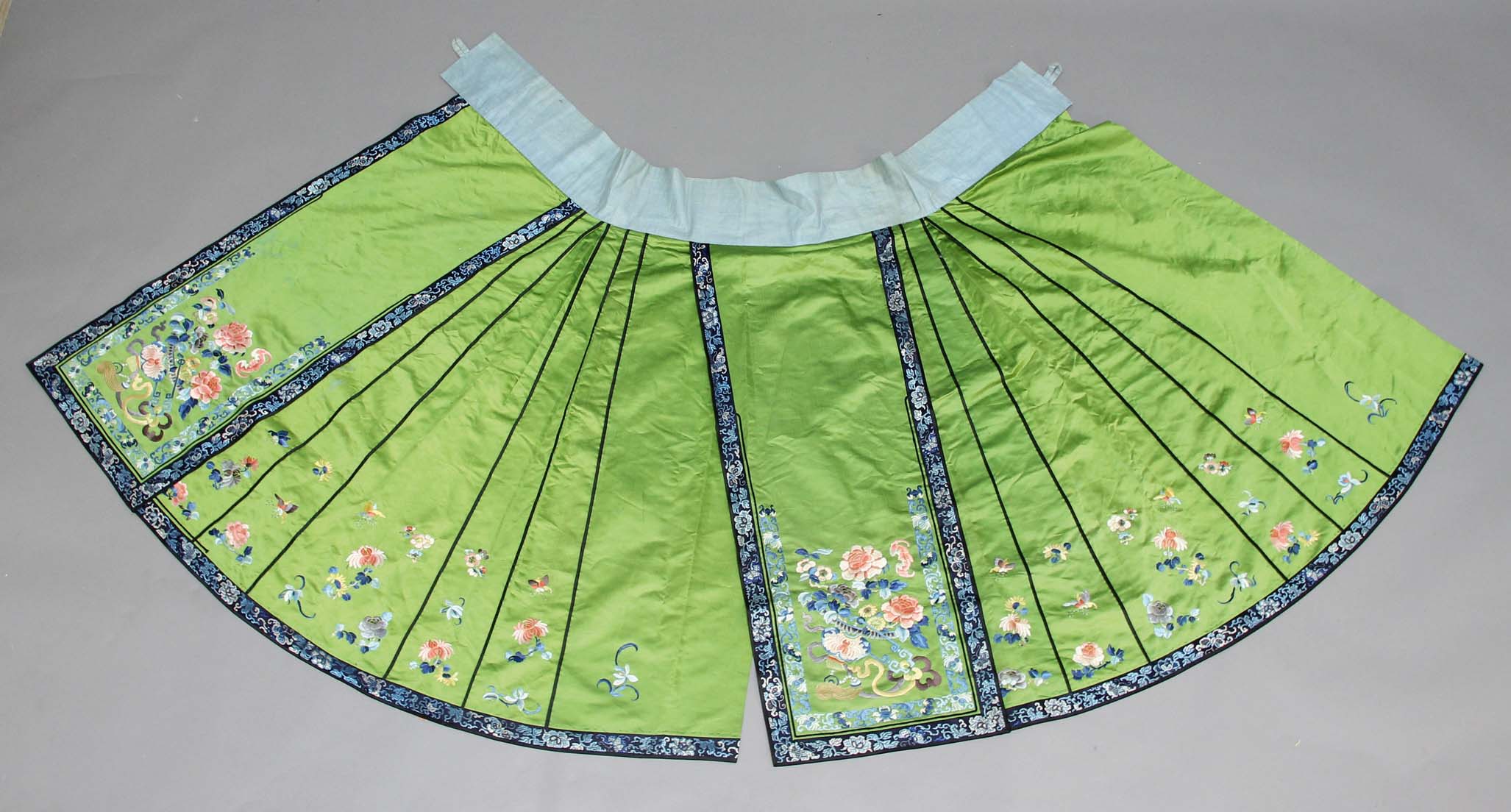 CHINESE SILK AND EMBROIDERED SKIRT, late 19th or early 20th century, the apple green ground worked