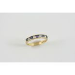 A SAPPHIRE AND DIAMOND HALF HOOP RING set alternately with circular-cut sapphires and circular-cut