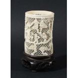 CHINESE IVORY RETICULATED TUSK VASE, later 19th century, carved with figures walking between pine