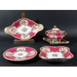 ROCKINGHAM DESSERT SERVICE, circa 1830, painted with floral sprays in gilt cornucopia on a raspberry