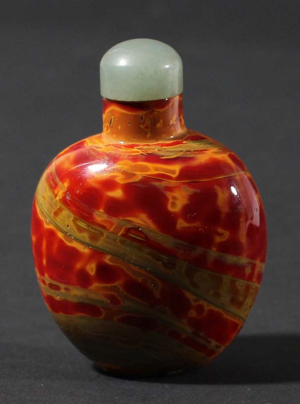CHINESE REALGAR GLASS SNUFF BOTTLE, possibly Qianlong, of ovoid form in mottled scarlet, yellow