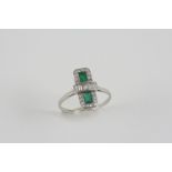 AN ART DECO EMERALD AND DIAMOND RING the two rectangular-shaped emeralds are centred with five