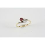 A RUBY AND DIAMOND CROSS-OVER RING the circular-cut ruby is set with an old brilliant-cut diamond,