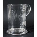 ENGLISH GLASS TANKARD, 18th century, with a moulded rim and flared foot, the body engraved with hops