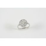 A DIAMOND CLUSTER RING the circular-cut diamonds weigh approximately 1.10 carats in total and are