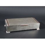ART DECO STYLE SILVER CIGARETTE BOX a silver cigarette box with bands of copper and a lined wooden