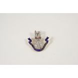 A DIAMOND AND ENAMEL REGIMENTAL BROOCH FOR THE LOYAL REGIMENT mounted with circular-cut diamonds,