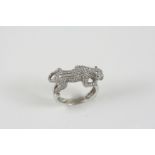 A DIAMOND SET PANTHER RING realistically formed, set overall with circular-cut diamonds, with