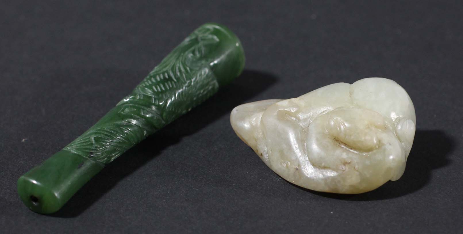 CHINESE GREY JADE CARVING, perhaps late Ming, of a leopard or chilong on a rock, length 4cm;