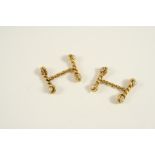 A PAIR OF GOLD, DIAMOND AND PEARL SET CUFFLINKS of rope link design, each link mounted with a