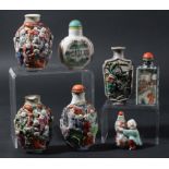 COLLECTION OF SEVEN CHINESE PORCELAIN SNUFF BOTTLES, including two moulded with lohan, another
