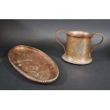 HUGH WALLIS - ARTS & CRAFTS CUP a copper two handled cup, hand beaten and inlaid with a floral
